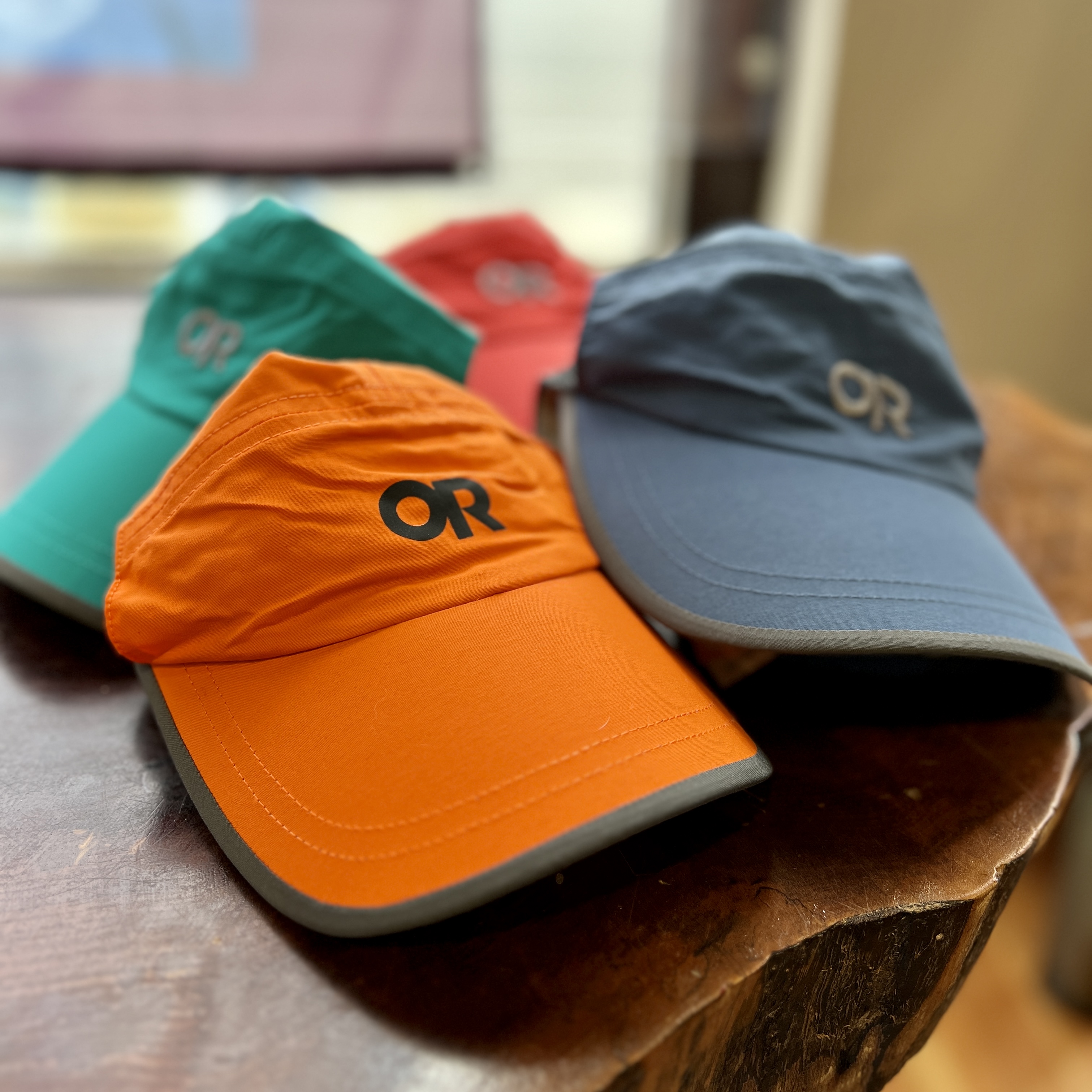 Outdoor Research brand lightweight running hats in an assortment of colors